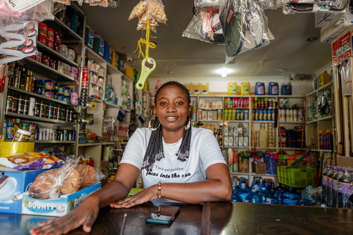 A woman running her well-stocked shop